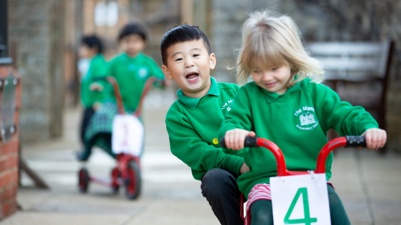 2 young students riding on a bicycle